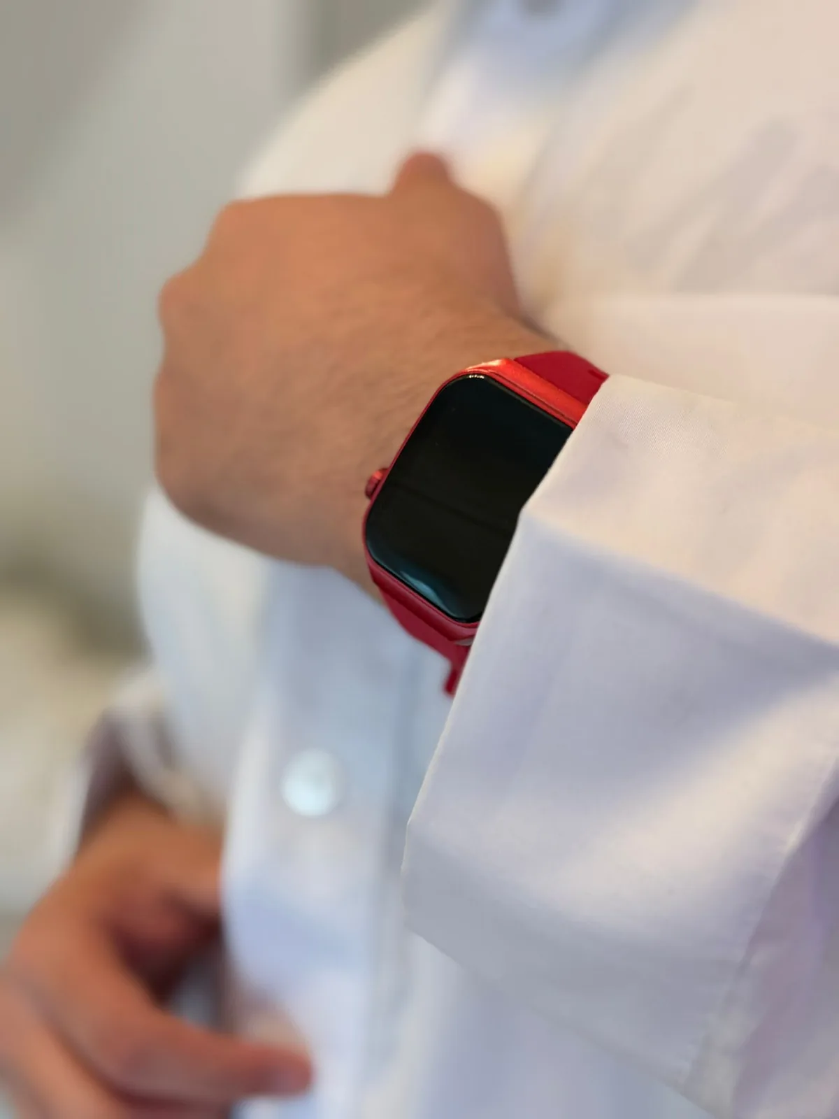 Red M² Watch portrait, white thobe